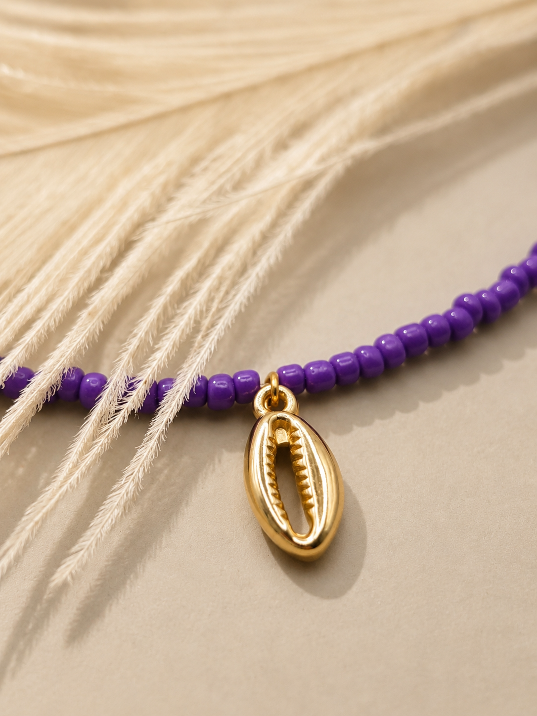 Paarse kralenketting met gouden schelphanger 💜